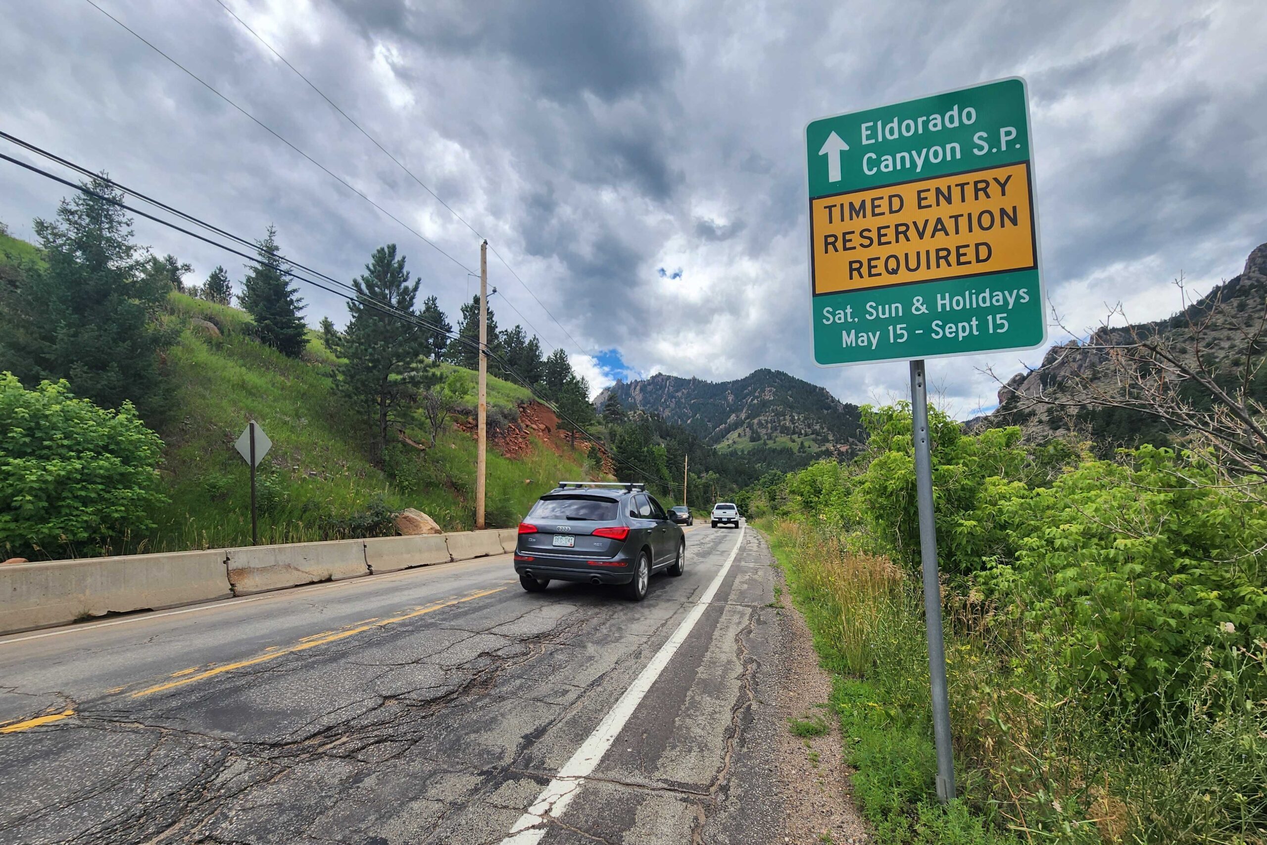 A sign outside Eldorado Canyon State Park displays the state park&#039;s timed reservation rules.