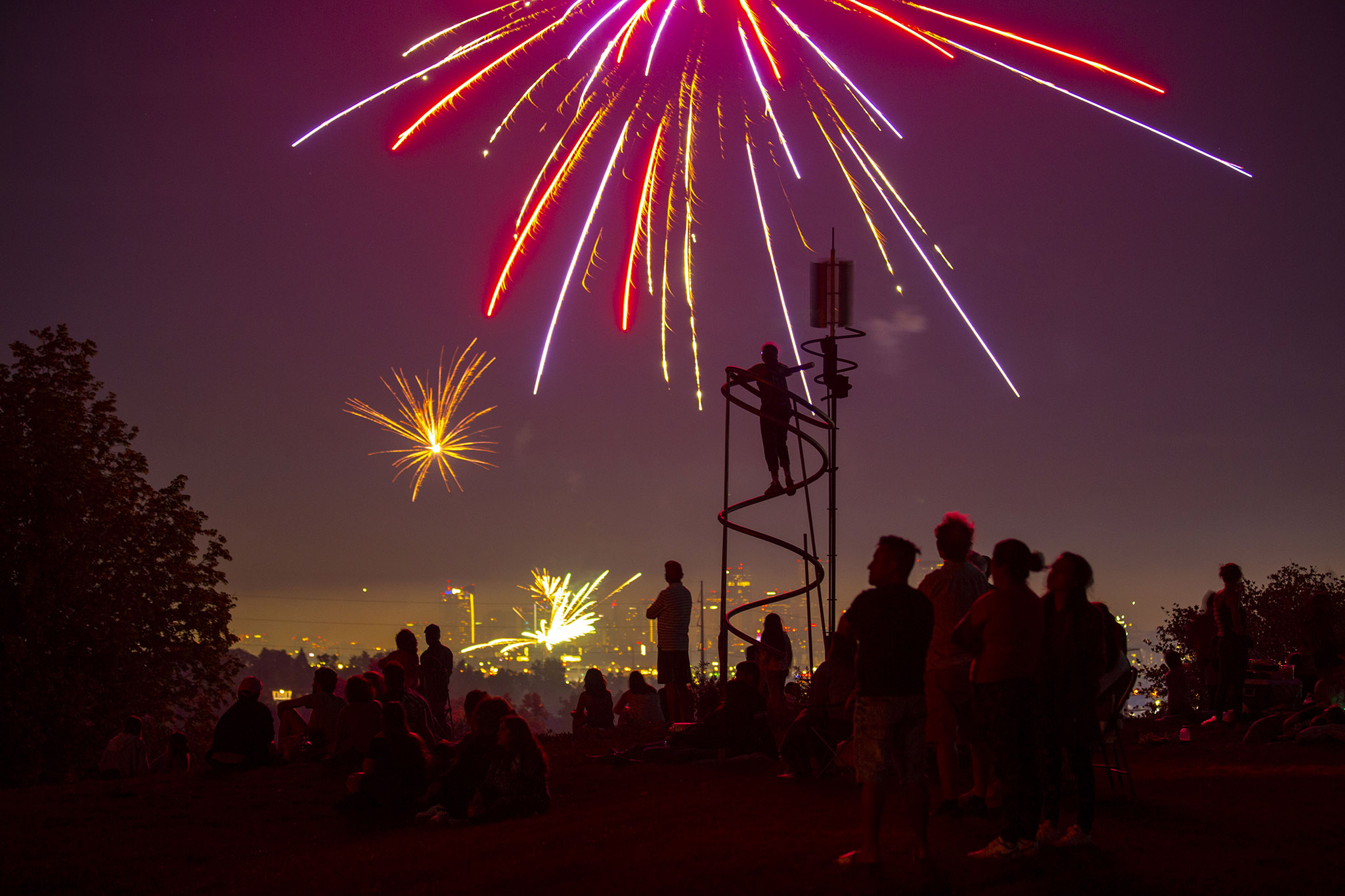 Fireworks explode all over the metro, as seen here from atop Ruby Hill. July 4, 2021.