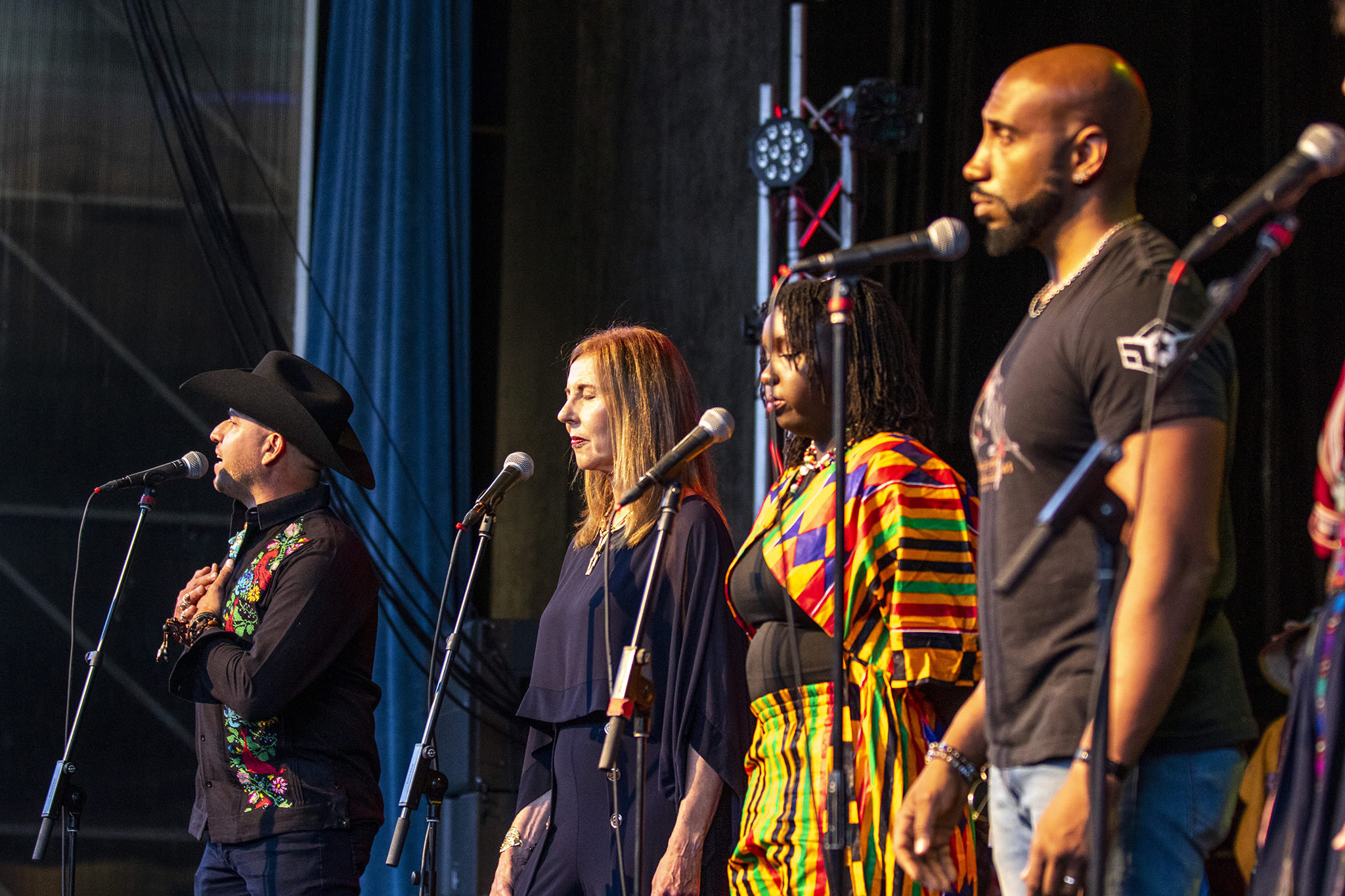 Jesús Quintana Martínez helps recite &quot;I Am The Bridge&quot; with his coauthors, a collaborative poem written for the African Leadership Group&#039;s Day of African Culture at the Arvada Center. Aug. 5, 2023.