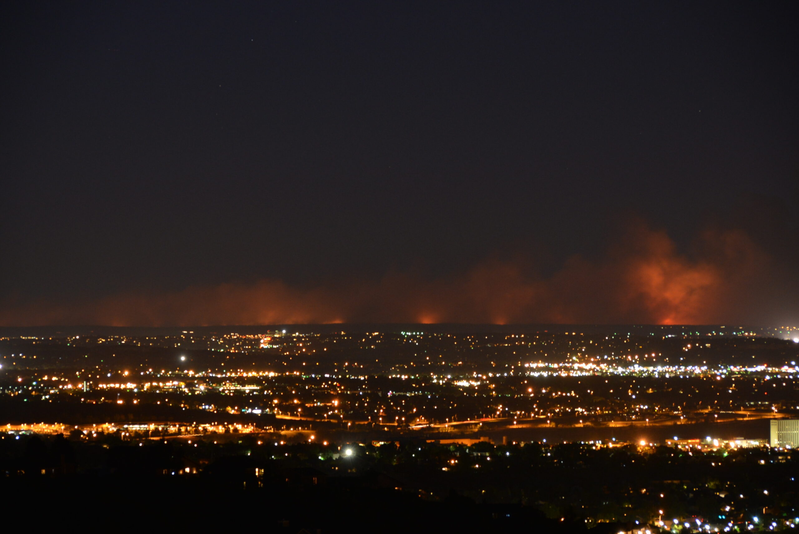 A night time image of the Black Forest Fire at 9:30 pm on the night of the first day, 11 June 2013. Photo was taken from the Broadmoor Bluffs neighborhood of Colorado Springs on the lower slope of Cheyenne Mountain, about 20 miles away.