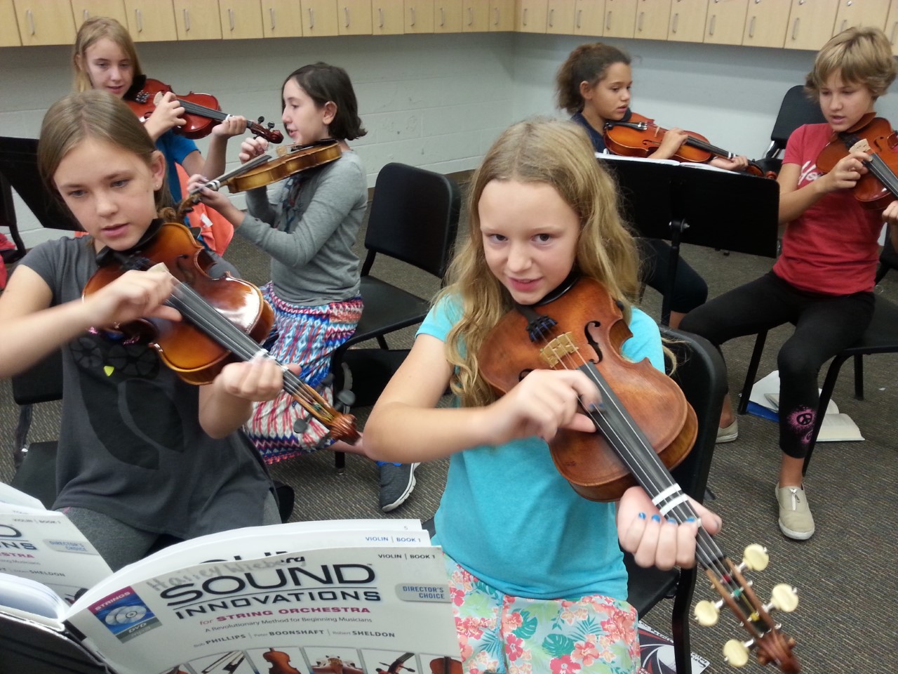East Middle School students with instruments donated by the Bringing Music To Life drive.