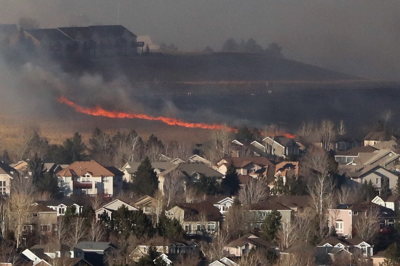 A line of flames visible inside a residential subdivision in the Superior area. Thursday, Dec. 30.